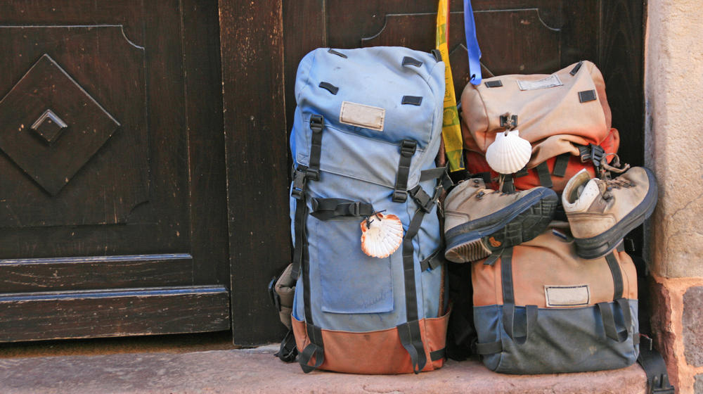 two huge backpacks in front of a dor